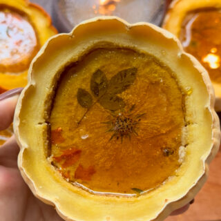 pumpkin pie creme brulee with caramel glass top and edible flowers