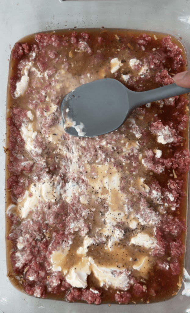stirring ingredients together in the casserole