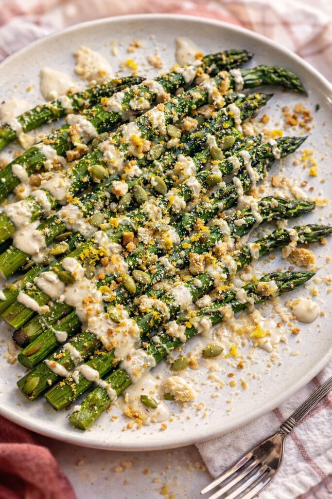 plate of asparagus with garlicky tahini sauce 